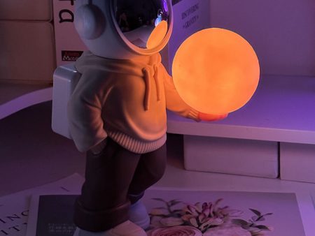 Holding the romantic moon (beige top + brown pants) Creative Astronaut Bluetooth Speaker with 3D Starry Sky Lighting, Portable Wireless Moon Lamp Speaker - Perfect Gift for Space Enthusiasts Online now